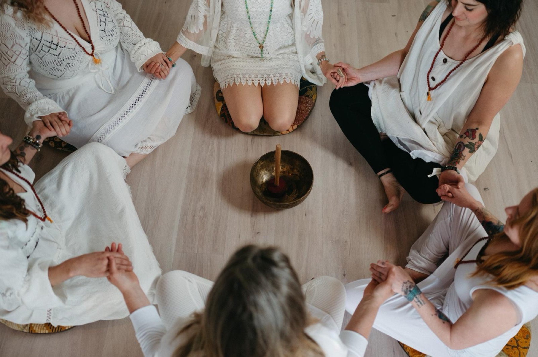 Yoga teacher training graduates seated in a mentorship circle
